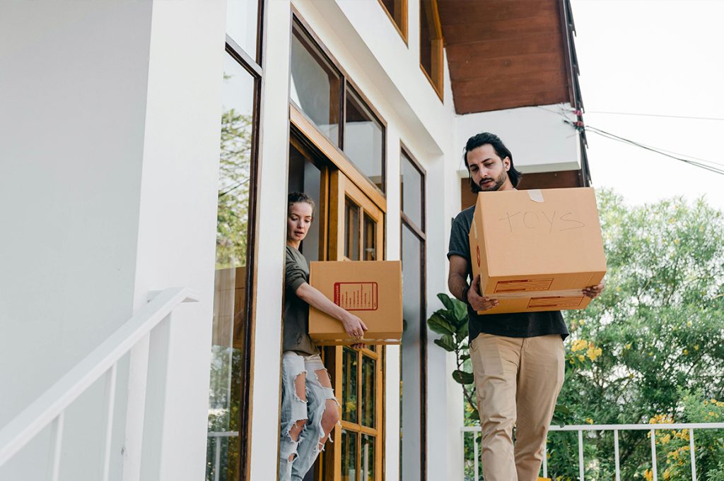 Man and woman moving boxes